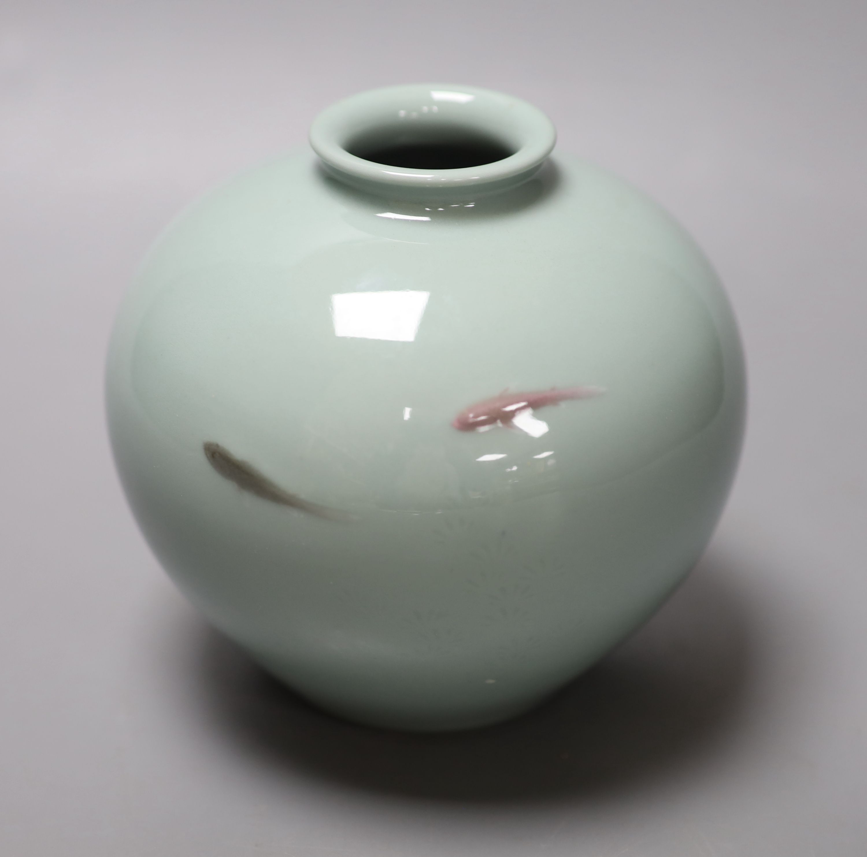 A Japanese celadon jar with fish and a Nabeshima style dish, both 1900, diameter 20cm